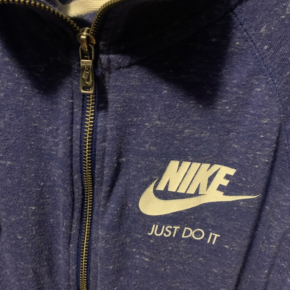 Nike Brand, lightweight, hooded zip-up. Women’s size medium.